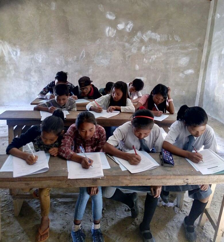 Students write exam at Longya Government Middle School in Kiphire town. (File Photo)